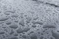 Natural water drops on a glass table after rain. Royalty Free Stock Photo