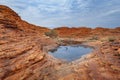 Natural water source located among the arid Kings Canyon, Northern Territory, Australia Royalty Free Stock Photo