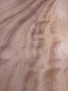 Natural Wavy Wood Grain Texture. Hardwood Surface Background. A light brown natural wood grain with wavy patterns Royalty Free Stock Photo