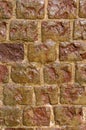 Wet weathered orange brick wall texture made of stone. background, architecture. Royalty Free Stock Photo