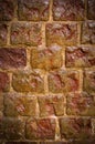 Wet weathered orange brick wall texture made of stone with vignette. background, architecture. Royalty Free Stock Photo