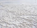 Natural white background. Granular crystalline salt desert texture.