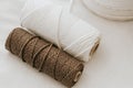 Natural White and Brown Macrame Cord on soft white blanket Royalty Free Stock Photo