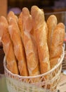 Natural wicker basket with freshly baked baguettes