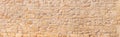 Natural wide panorama wall design pattern background  rustic rough warm sand stone texture Royalty Free Stock Photo
