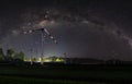 Natural wind power plant and sustainable eco-friendly energy resources at night with sky full of stars and milky way