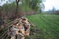 Natural wood background - closeup of chopped firewood. Firewood stacked and prepared for winter. A pile of firewood by the road Royalty Free Stock Photo