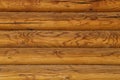 Natural background log wall. Texture of wooden logs. Royalty Free Stock Photo