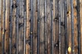 Natural wood background. Old dark vintage brown wooden wall, wood texture, fence near house., ancient building, floor Royalty Free Stock Photo