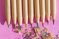 Natural wood colored pencils with shavings on a background of purple paper Royalty Free Stock Photo