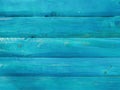 Natural wood planks making a wall or ground colored with blue paint for an interesting look with rough surface texture Royalty Free Stock Photo