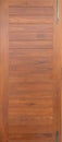 Natural wood slats door or lath line arrange patter. Flooring pattern surface texture. Close-up of interior architecture material