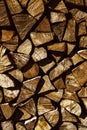 Natural wooden background, closeup of chopped firewood. Firewood stacked and prepared for winter Pile of wood logs Royalty Free Stock Photo