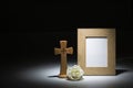 Natural wooden picture frame with wooden crucifix and white rose Royalty Free Stock Photo