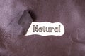 Natural word written on torn leather