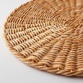 Natural woven wicker placemat on clean white background Royalty Free Stock Photo