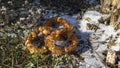 Natural yellow amber bracelets on a snow outside.