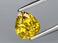 natural yellow chrysoberyl gem on the background Royalty Free Stock Photo