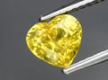 natural yellow chrysoberyl gem on the background Royalty Free Stock Photo