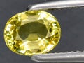 natural yellow chrysoberyl gem on the background Royalty Free Stock Photo