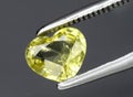 Natural yellow chrysoberyl gem on the background Royalty Free Stock Photo
