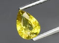 natural yellow chrysoberyl gem on the background Royalty Free Stock Photo