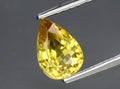 natural yellow chrysoberyl gem on the background Royalty Free Stock Photo