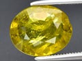 natural yellow green grossular garnet gem on the background Royalty Free Stock Photo