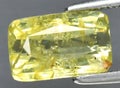 Natural yellow grossular garnet gem on the background Royalty Free Stock Photo