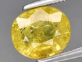 natural yellow grossular garnet gemstone on the background Royalty Free Stock Photo