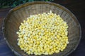 Natural yellow silkworm cocoons in a vintage bamboo basket