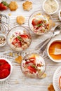 Natural yogurt with fresh fresh strawberries, granola, honey, nuts and seeds in a glass dishes. Delicious breakfast or dessert. Royalty Free Stock Photo