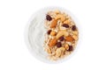 natural yogurt with homemade granola and nuts in ceramic bowl top view isolated white background Royalty Free Stock Photo