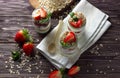 Natural yogurt with jam, muesli and fresh strawberry, mint leaves. Healthy breakfast concept. Royalty Free Stock Photo