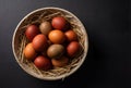 Naturally Dyed Easter Eggs in Ceramic Bowl with Straw ?????????? ???? ? ????? ? ??????? Royalty Free Stock Photo