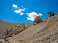 Naturally formed rock shapes and mountains with beautiful blue sky , clouds background on adventurous road from Manali to Leh in