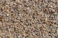 Naturally rounded gravel at sea shore, nature beach background t