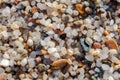 Naturally rounded gravel at sea shore, nature beach background t