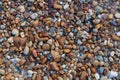 Naturally rounded gravel at sea shore, nature beach background texture Royalty Free Stock Photo