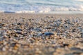 Naturally rounded gravel at sea shore, nature sea background tex