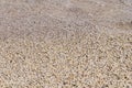 Naturally rounded gravel at sea shore, nature sea background tex