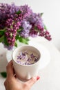 Naturals soy candle, spring flowers lilac Royalty Free Stock Photo