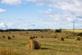 Nature background. Bales of hay in an agricultural field. Wheat field after harvest in Russia. Agricultural landscape