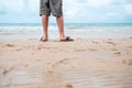 Nature background close up leg of men standing alone on beach wi Royalty Free Stock Photo