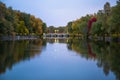 Nature background - old bridge slow river night time. Autumn