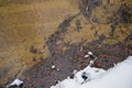 rippling water of a creek with brown soil Royalty Free Stock Photo