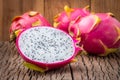 Nature can be pretty weird sometimes, Dragon-fruit are nutritious tropical fruit That way your fruits setup on wooden background. Royalty Free Stock Photo