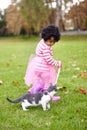 Nature, cat and girl playing in a garden on the grass on a summer weekend together. Happy, sunshine and portrait of Royalty Free Stock Photo