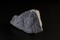 Chromite stone mineral greenish-gray color on dark background