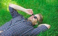 Nature fills him with freshness and inspiration. Man unshaven guy lay on green grass meadow. Natural freshness. Man Royalty Free Stock Photo